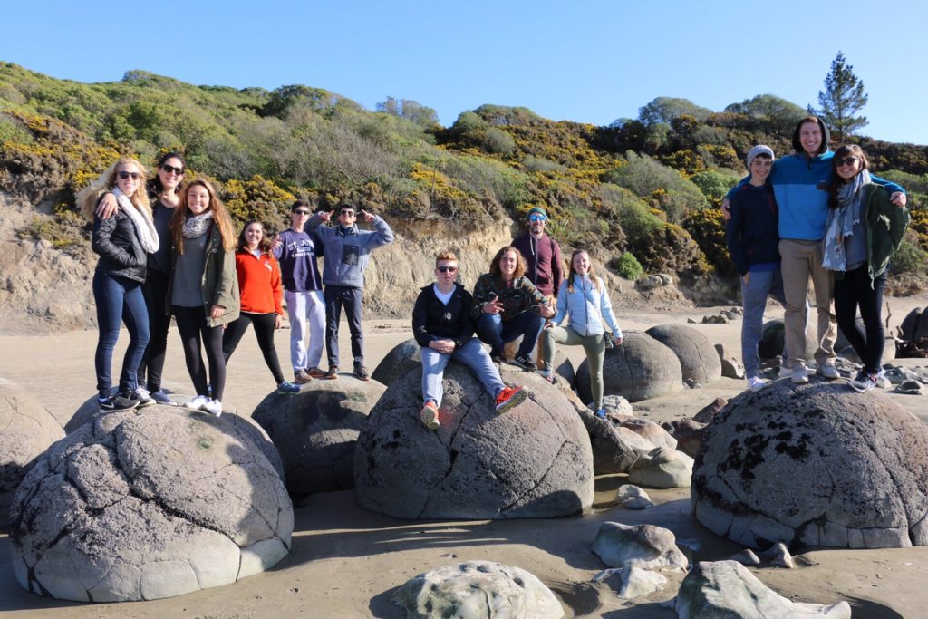 Family photo on top of the Moeraki boulders